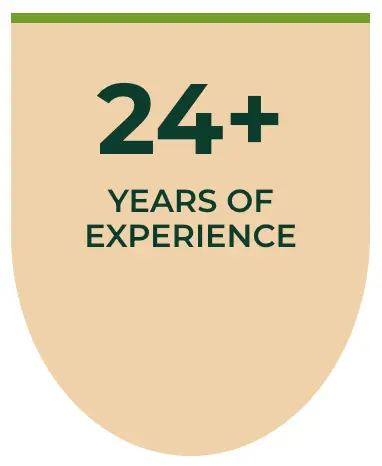 A beige shield-shaped graphic with a green border at the top. Large dark green text reads 24+ above smaller text that says YEARS OF EXPERIENCE.